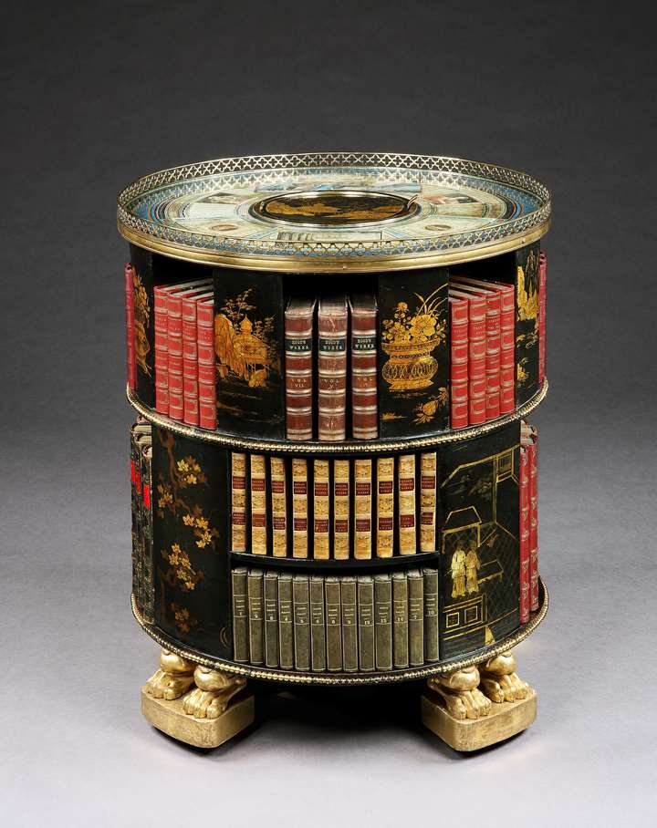 A rare Regency period painted and gilded circular bookcase with Chinese lacquer panels